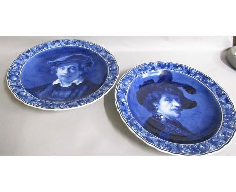 A pair of Porceleyne Fles delft portrait chargers after Rembrandt, c.1916 &amp; 1917, each 47cms diam. 