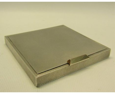 A 20c silver engine turned compact, makers mark for David Sutton &amp; Sons, London 1949.  7.5cms sq. 