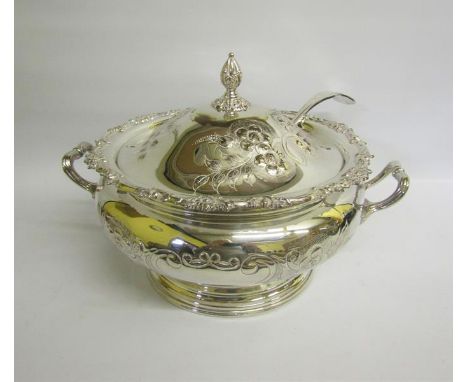 A silver plated two handled soup tureen on a circular stepped base.  Chased and embossed with a band of flowers, having two o