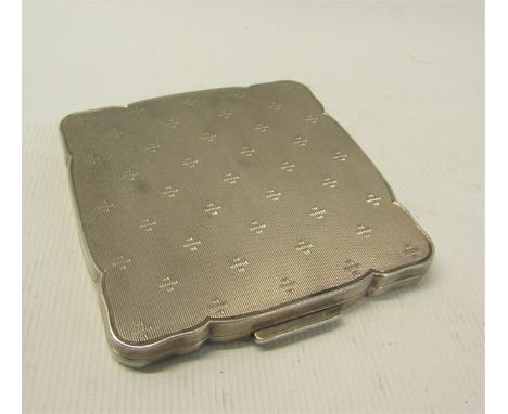 An art deco period German silver compact, engine turned.  925 sterling.  7cms sq. 