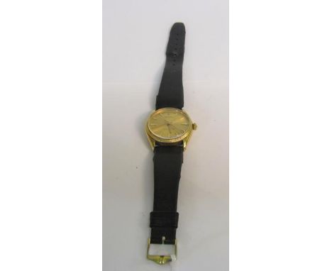 A Rolex Oyster Perpetual gentleman's chronometer wristwatch with mechanical movement in 18ct gold case with satin gold dial a