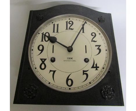 An early 20c movement from an industrial time clock complete with its mounting bracket now mounted on a timber backboard.  Th