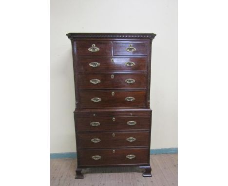 A George III mahogany chest on chest, the upper section of two short and three long drawers with dentil moulded cornice and b