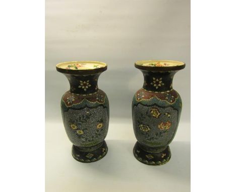 A pair of Meiji period cloisonné ceramic satsuma vases on blue backgrounds, decorated with panels of flowers.  27cms h. 