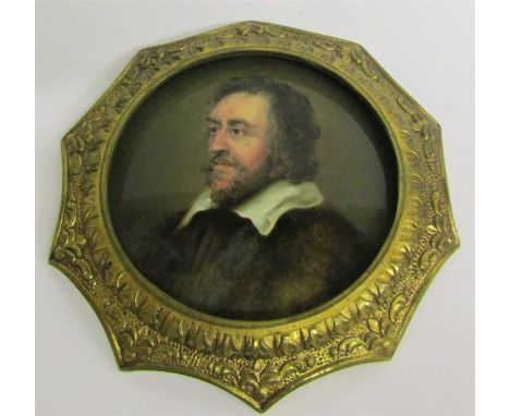 A 19c miniature oil on porcelain panel, portrait of a gentleman with beard and wearing a fur coat.  Circular brass framed.  1