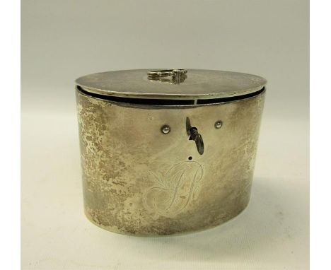 A George III silver locking tea caddy of oval form with hinged cover having ring pull central handle.  Makers mark for Richar