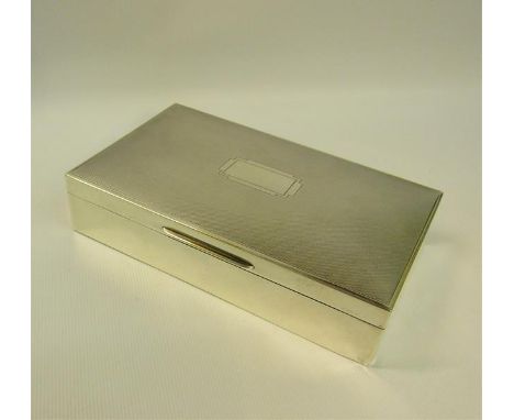 A 20c silver cigarette box of rectangular form, the hinged cover engine turned.  Makers mark for Mappin &amp; Webb, Birmingha