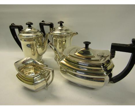 A silver four piece tea and coffee service comprising tea and coffee pot together with water jug and cream jug.  Birmingham 1