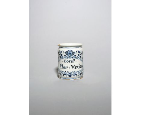 A French faïence albarello  c.1690-1740, the slightly waisted form painted in blue with a shaped cartouche inscribed 'Conf. f