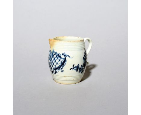 An unusual Lowestoft blue and white cream jug  c.1770-75, of rare barrel-shape, beneath the spout painted with a large trelli