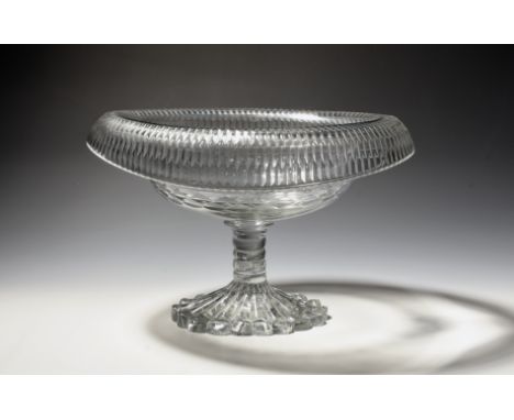 An Irish cut glass bowl or centrepiece  c.1820, of navette shape, the turnover rim cut with bands of fluting, raised on a bob