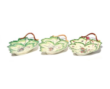 Three Worcester double leaf dishes  c.1770, each moulded with two overlapping vine leaves, painted with an arrangement of flo