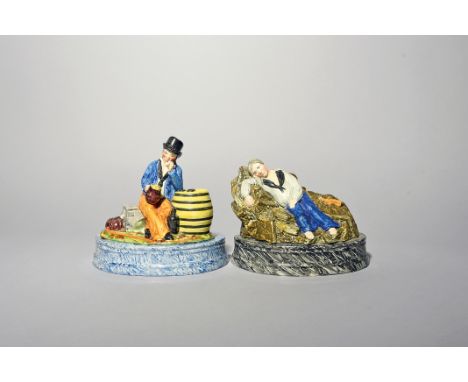 A rare pair of creamware figures of sailors  c.1830-40, one seated on his trunk with one elbow resting on a barrel, smoking h