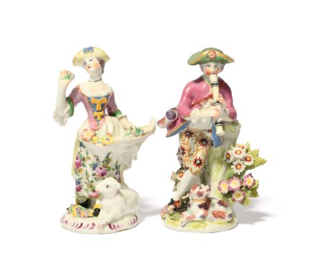 A matched pair of Bow figures of a piping shepherd and his companion c.1758-65, he playing the flageolet with a dog at his fe