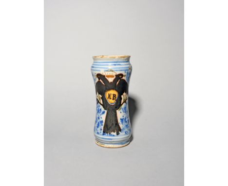 A Spanish or Portuguese faïence albarello or drug jar  dated 1730, the narrow waisted form decorated in copper lustre with a 