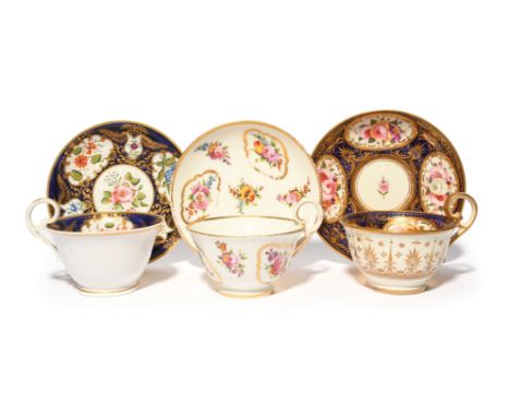 A Nantgarw cup and saucer  c.1815-20, painted with small floral panels and further flower sprays, and two Swansea-style cups 