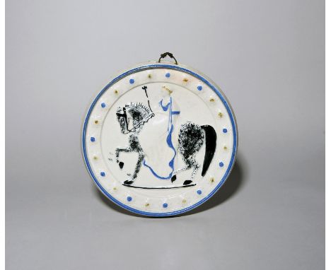 A large Scottish pearlware circular portrait plaque of Queen Victoria  c.1854, moulded in relief with the queen on horseback 