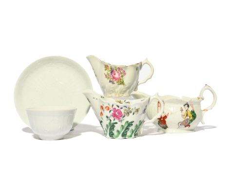 Three Worcester creamboats  c.1765-75, two of Low Chelsea ewer form, variously painted with flowers, the last of a squat stra