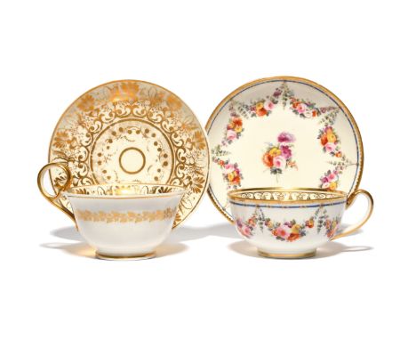 Two Nantgarw cups and saucers  c.1818-20, one painted with a garland of flowers suspended from a Sèvres-style blue border wit