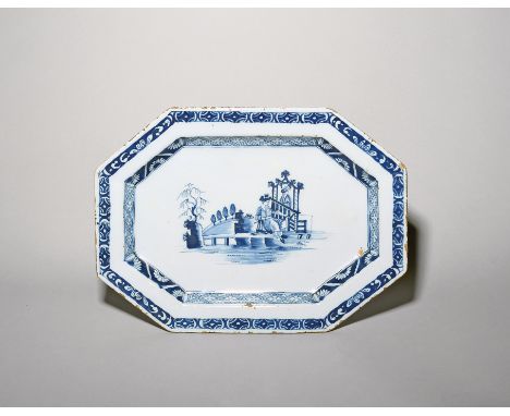 An octagonal delftware charger  c.1770, Dublin or Liverpool, painted in blue with La Pêche, a lady fishing and watched by a f