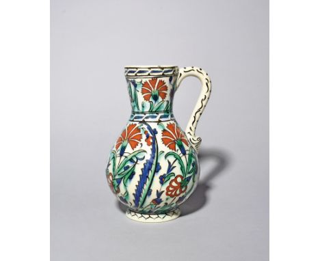 A Samson Iznik-style jug  late 19th century, boldly painted in traditional style with red carnations between blue and green s