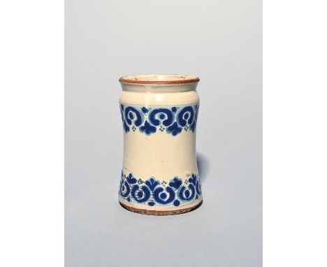 A Talavera de Pueblo (Mexico) maiolica albarello  18th century, the small waisted form decorated in a thick blue with C scrol