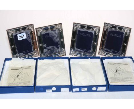 Set of four hallmarked sterling silver R. Carr photograph frames, boxed.