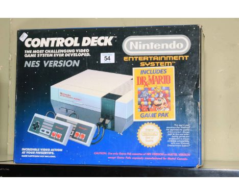 Nintendo Nes console with two controllers, in box.