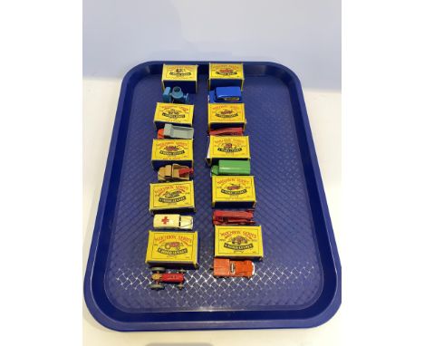 Ten boxed Matchbox 1-75 Series diecast models, to include a no. 14 ambulance and a no. 9 fire engine