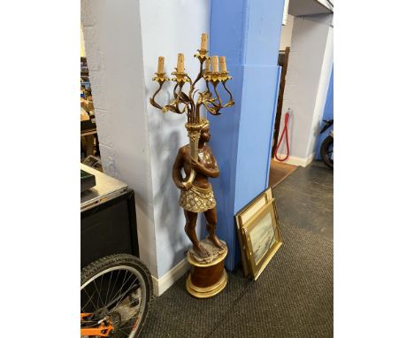 A Blackamoor floor standing seven branch lamp, measuring 167cm H