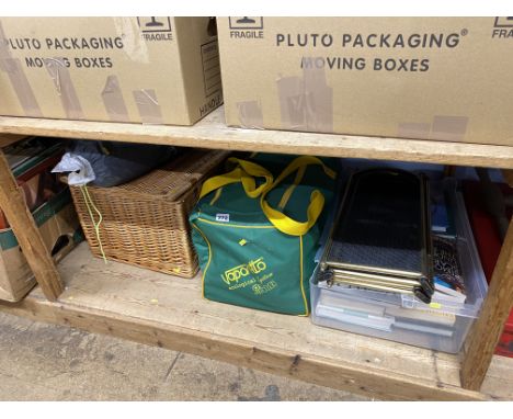 Duffel bag, books and a fire screen