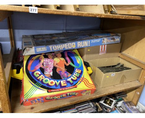 Shelf of vintage toys and games