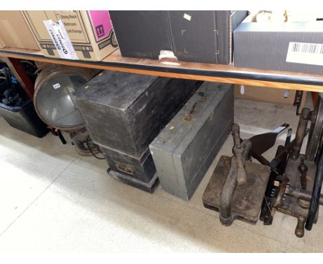 A light, book press and carpenter chests