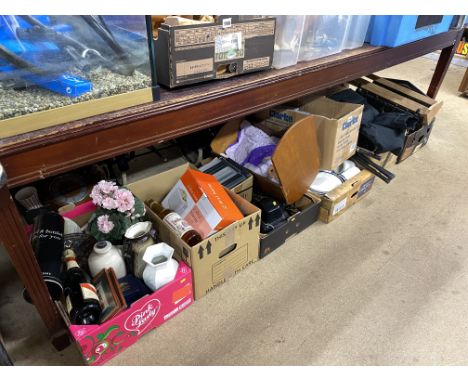 A quantity of boxes of camera, DVDs, CDs, walking poles, bottled alcohol and a doll's crib