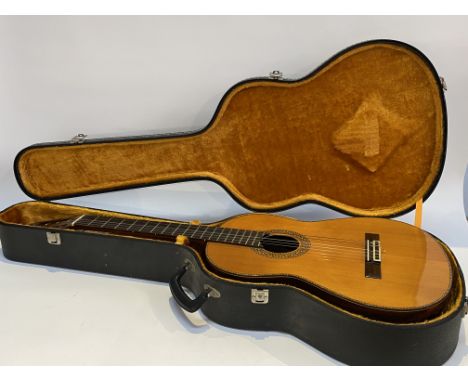 A Marklin acoustic guitar with case, model number MC-325
