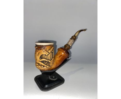 A Meerschaum pipe, with a mother of pearl shank, on stand