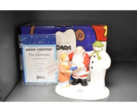 A Coalport characters first edition figural group, Father Christmas and the snowman, the special gift.