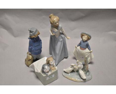 A group of Nao Figures and studies, including Girl with fan and kittens in gift box.