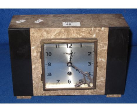 Art deco design marble and black slate box shaped mantle clock with silvered square face.