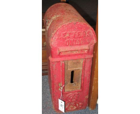 An Edward VII cast metal arch topped, red painted letter box.