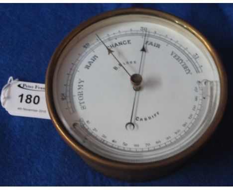 Brass drum shaped hanging barometer marked B.Biggs Cardiff.