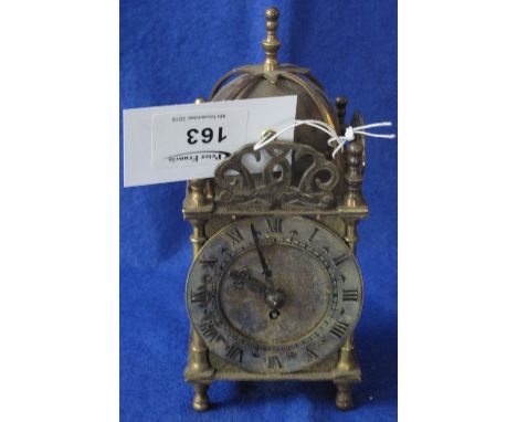 Small gilt brass lantern type mantle clock.