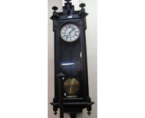 20th Century ebonised single train Vienna type wall clock.