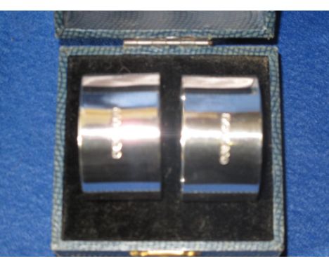 Cased pair of plain silver napkin rings.  Sheffield hallmarks. 