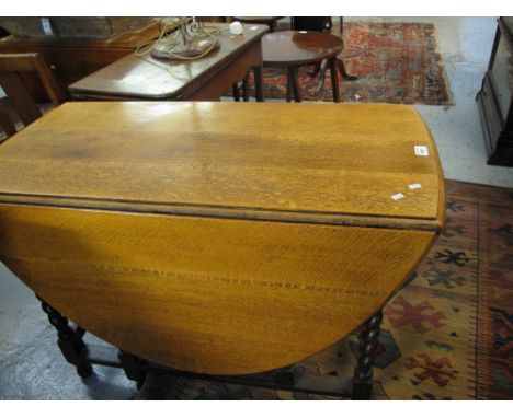 Early 20th Century oak barley twist gate leg table.