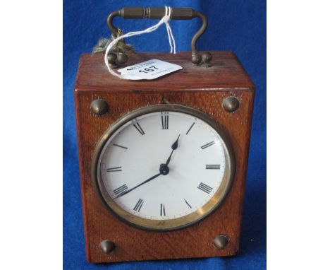 Early 20th Century oak mantle clock with enamel face and French brass drum movement.