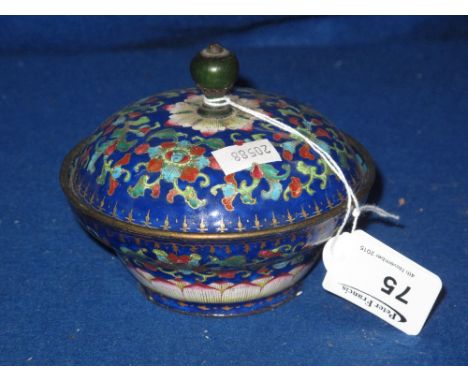 A Chinese Peking enamel bowl and cover of cushion form, overall decorated with floral and foliate designs on predominantly da