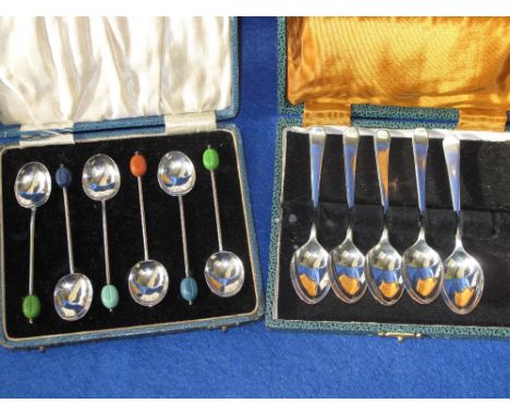 Cased set of silver coffee bean spoons with Birmingham hallmarks  (6).  And a cased set of silver egg spoons with Sheffield m