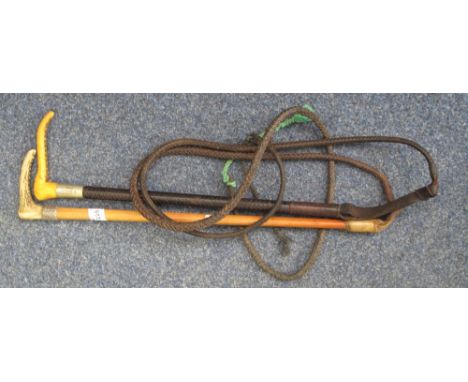 A horn handled hunting crop with gate push and lash, and another similar with leather finish and lash.  (2)