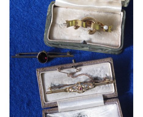 15ct gold ruby and pearl brooch, 18ct gold garnet set brooch and a yellow metal Victorian design brooch. (2 cased).   (3)
